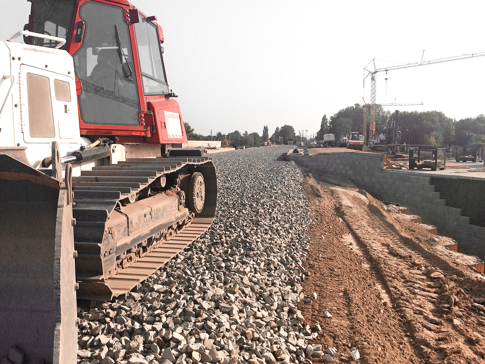 a roller from BTB applies railway ballast for a new railway embankment
